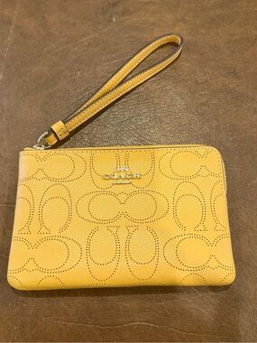 COACH Corner Zip Wristlet in Signature Perforated Leather Yellow